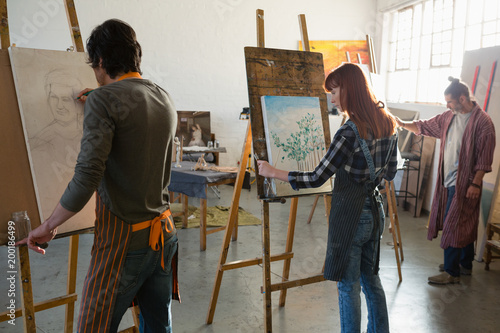 Artists painting on canvas photo