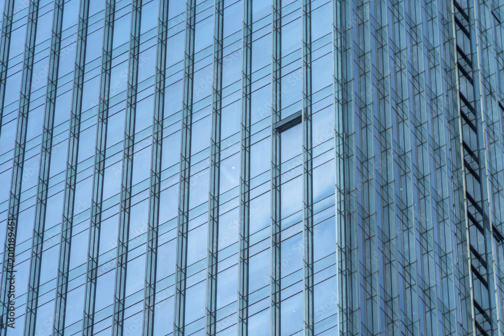 Glass wall of business center and sky reflection. Glass wall of business center and sky reflection.