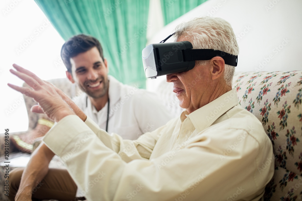 Senior man using an oculus rift Senior man using an oculus rift
