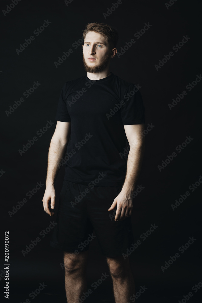 Portrait of a serious sportsman that is staying and looking away. Portrait of a serious sportsman that is staying and looking away.