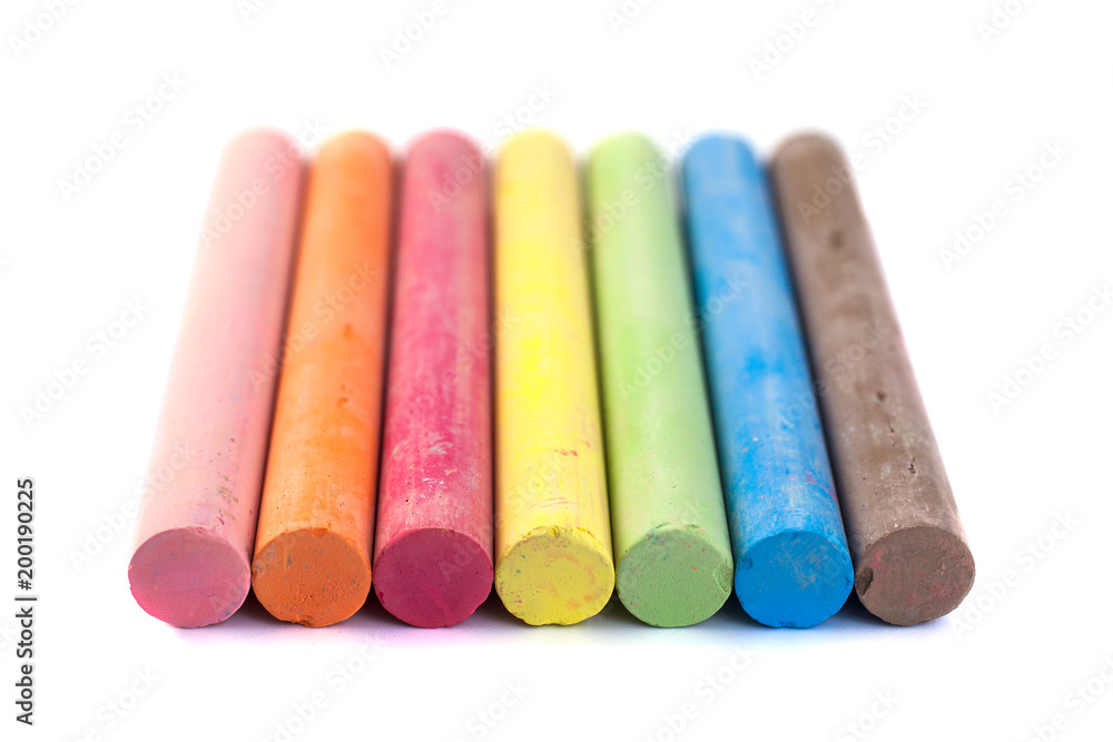 Colored chalks on white background with soft shadows Colored chalks on white background with soft shadows