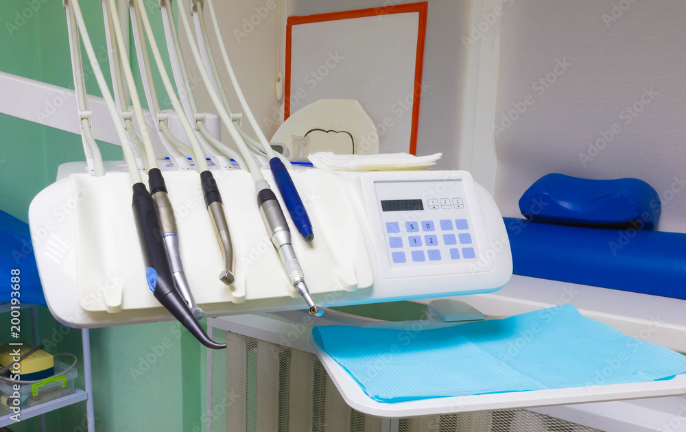 Different dental instruments and tools in a dentists office Different dental instruments and tools in a dentists office