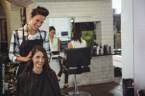 Female hairdresser working on the client photo