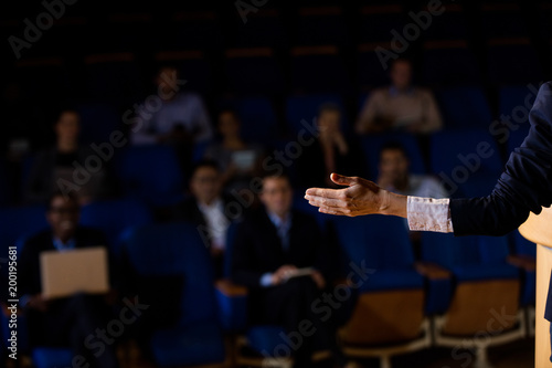 Male business executive giving a speech photo