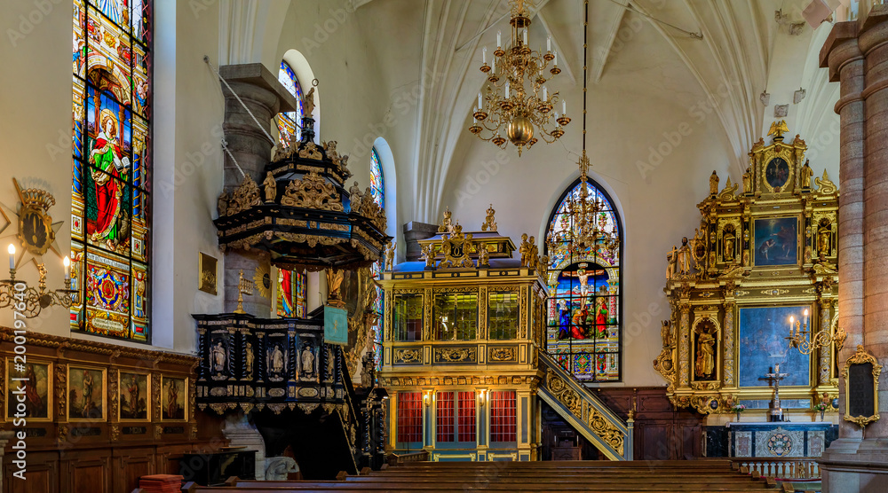 Obraz premium Stained glass windows, the altar, the pulpit and the 