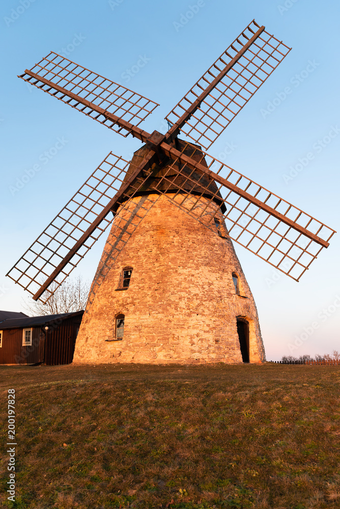 Limestone windmill in sunset sunlight. Location Karlevi on Oland, Sweden.