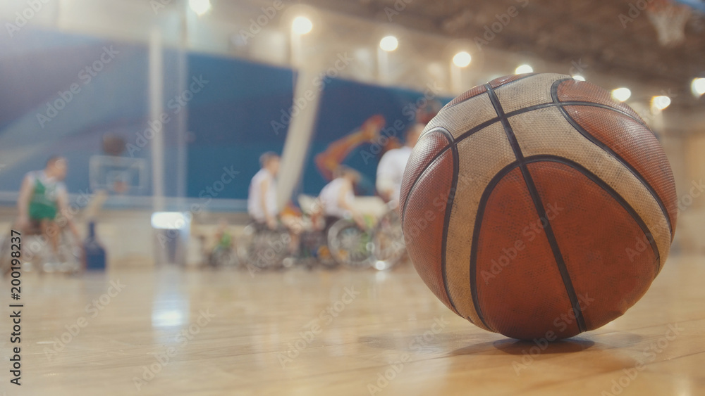 Ball of basketball during training for disabled wheelchair sportsmen Ball of basketball during training for disabled wheelchair sportsmen