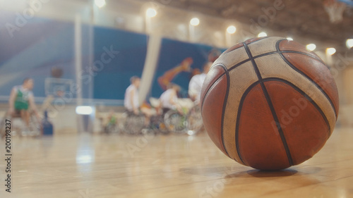 Ball of basketball during training for disabled wheelchair sportsmen © KONSTANTIN SHISHKIN