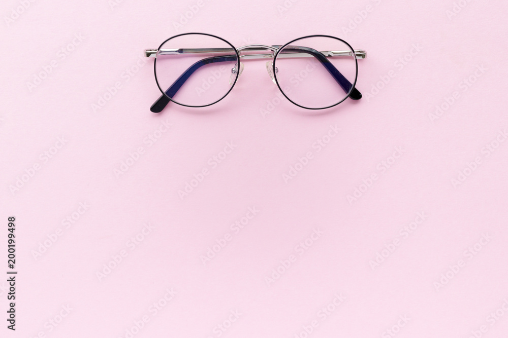 Minimal composition with glasses on a pink pastel background Minimal composition with glasses on a pink pastel background
