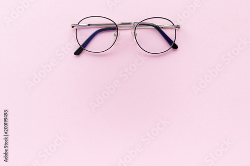 Minimal composition with glasses on a pink pastel background