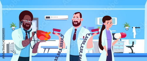 Team Of Medical Doctors Holding Equipment For Cardiac Resuscitation Over Hospital Ward Background Vector Illustration