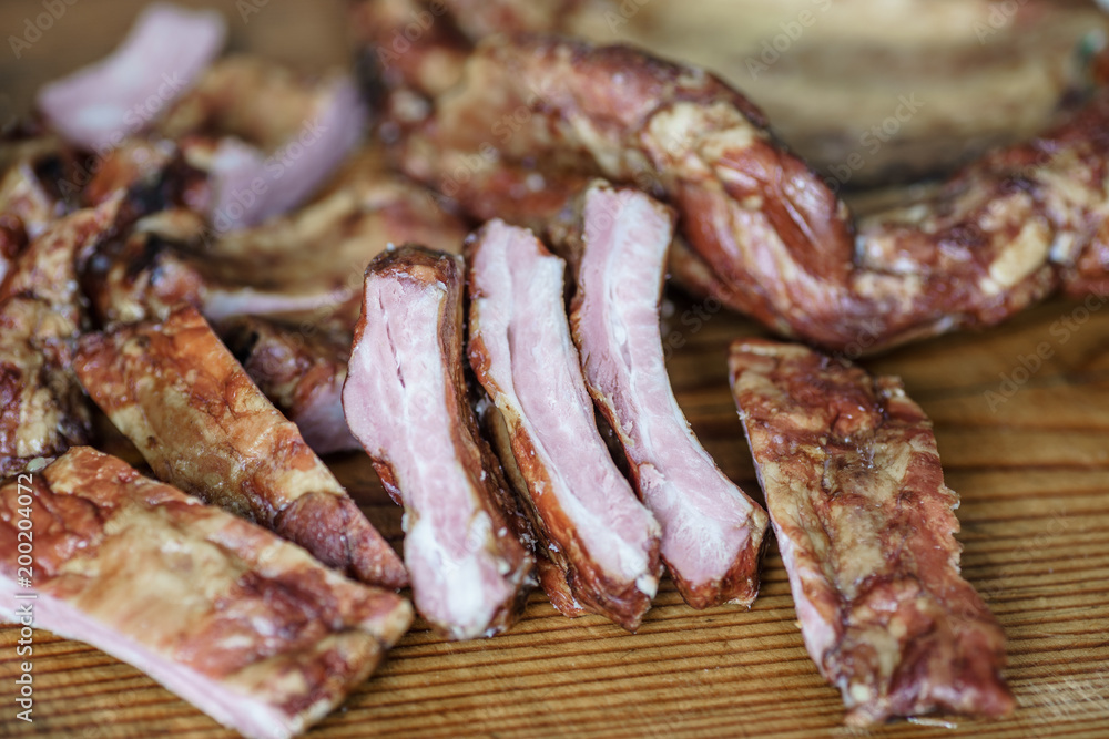 Raw pork ribs , on a wooden dinette Raw pork ribs , on a wooden dinette