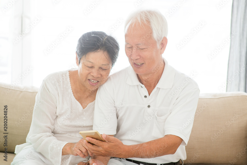 Old couple using smart phones Old couple using smart phones
