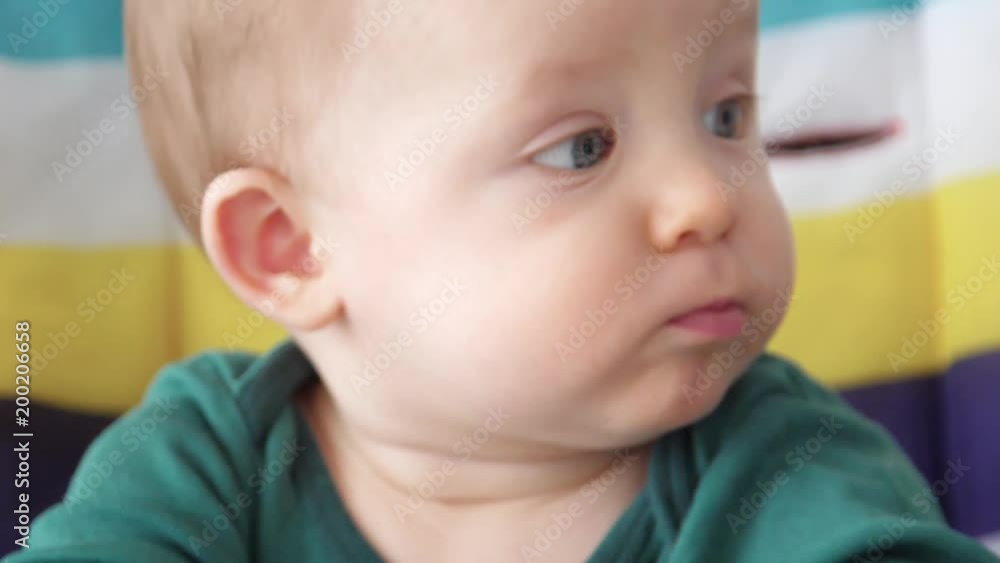 baby sitting in a high chair waiting for food