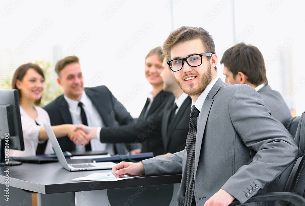 Fototapeta premium handshake business partners with the Manager in the foreground