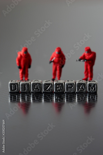 Diazepam on beads with a miniature scale model safety chemicall team photo