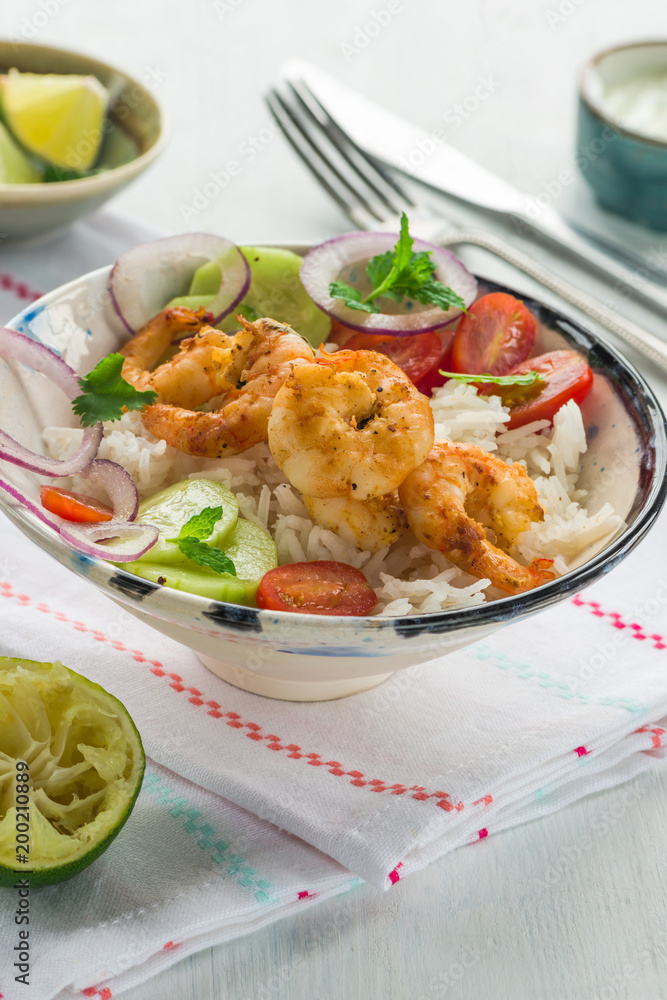 Tandoori prawns with rice and chopped salad Tandoori prawns with rice and chopped salad