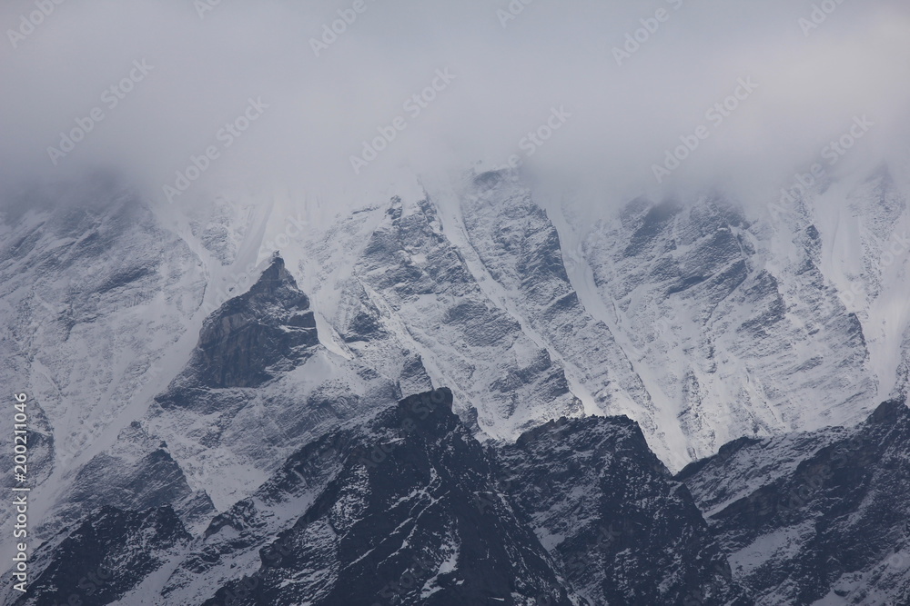 Detail of a mountain of the Langtang Himal, Nepal. Cloudy day in the Himalayas.