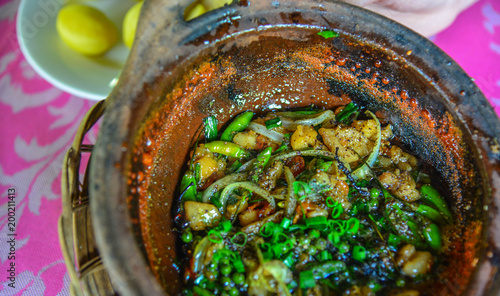 Traditional stew pork with pepper photo