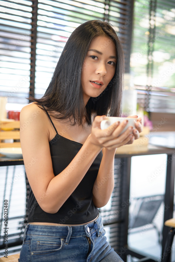 Asian woman drinking coffee for relax Asian woman drinking coffee for relax