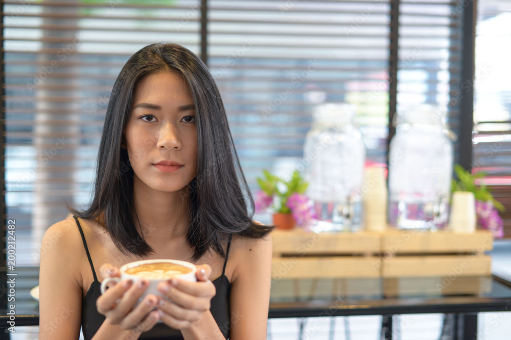 Asian woman drinking coffee for relax Asian woman drinking coffee for relax