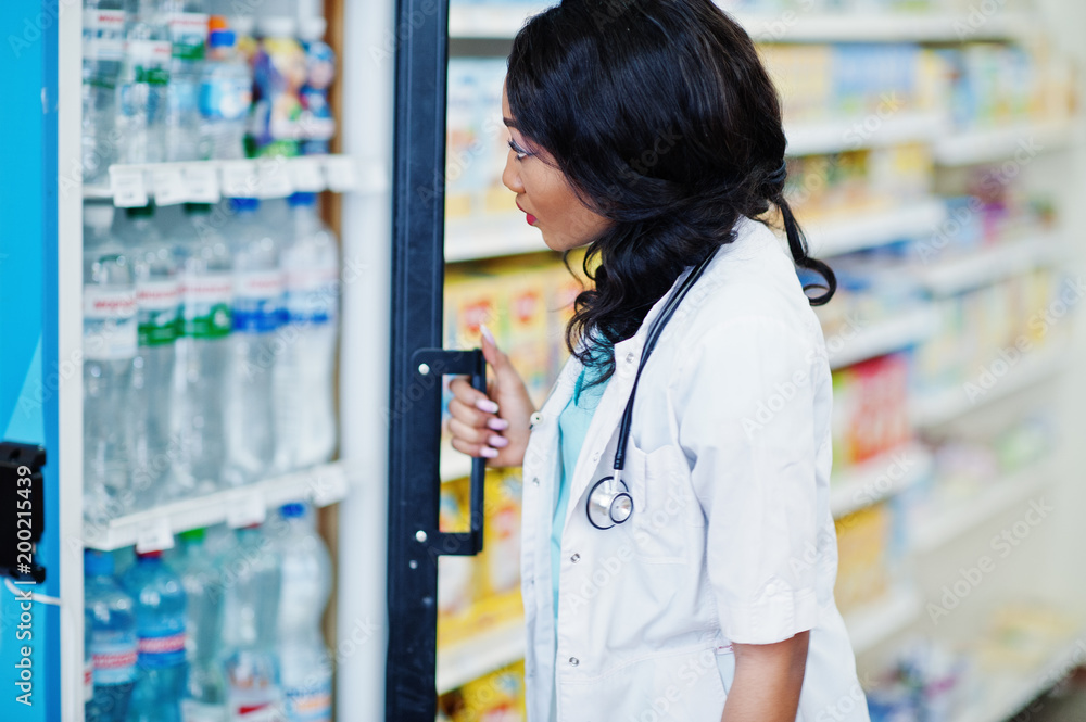 African american pharmacist working in drugstore at hospital pharmacy. African healthcare. African american pharmacist working in drugstore at hospital pharmacy. African healthcare.