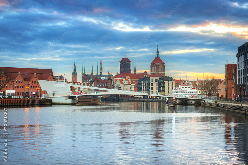 Old town of Gdansk reflected in Motlawa river at sunset, Poland