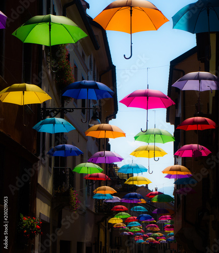 Wallpaper Mural A street of small italian city roofed with  a lot of colorful umbrellas during a summer sunny day. Torontodigital.ca