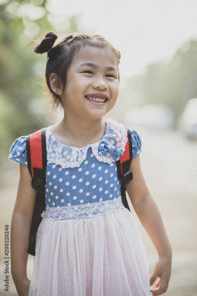 cheerful asian children school pack on back toothy smiling face outdoor cheerful asian children school pack on back toothy smiling face outdoor