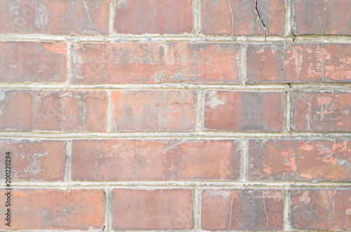 Old brown brickwork with different defects