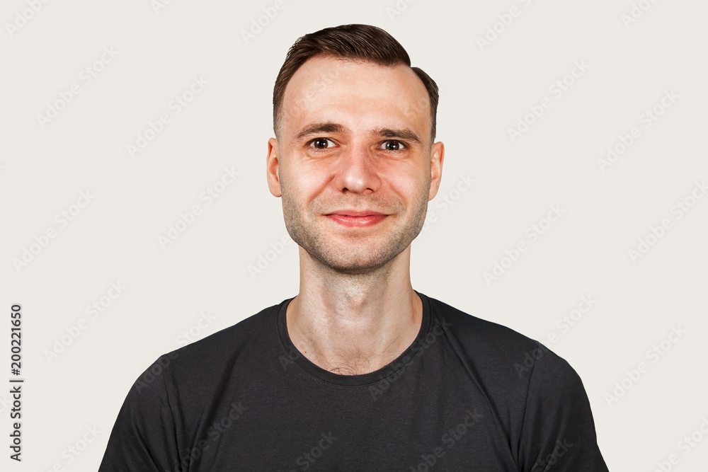 Funny young smiling guy on gray background. Funny young smiling guy on gray background.