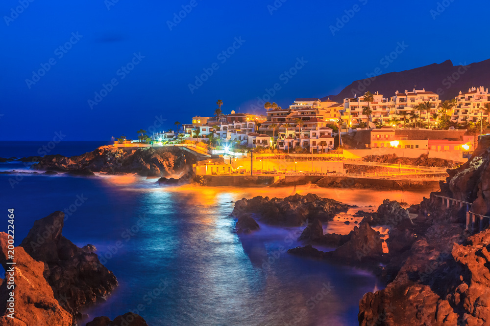 Night scene over Santiago de Tenerife cityscape, illuminated architecture in evening, Canary island, Spain