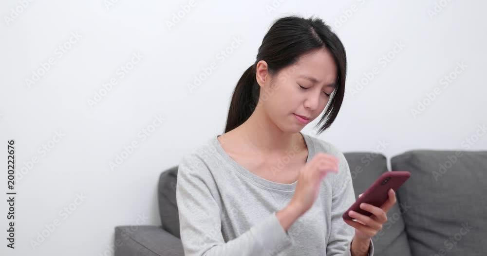 Woman feeling tired on eye with using mobile phone Woman feeling tired on eye with using mobile phone