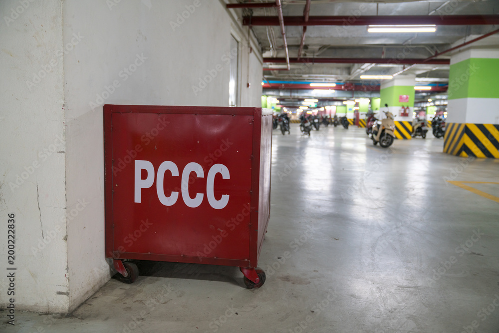 Firefighting box with sand in underground parking of modern building ...