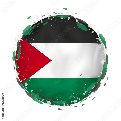 Round grunge flag of Palestine with splashes in flag color.