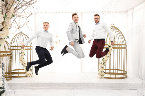 Happy handsome groom with b...