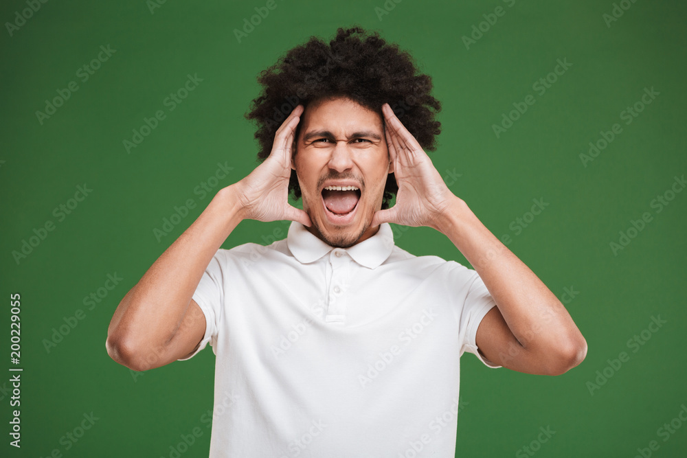Screaming young african curly man isolated Screaming young african curly man isolated
