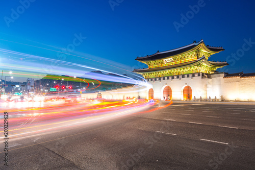 Gyeongbokgung Palace, Cars passing in front of Gwanghuamun gate after sunset in downtown Seoul, South Korea. Name of the palace 'Gyeongbokgung'