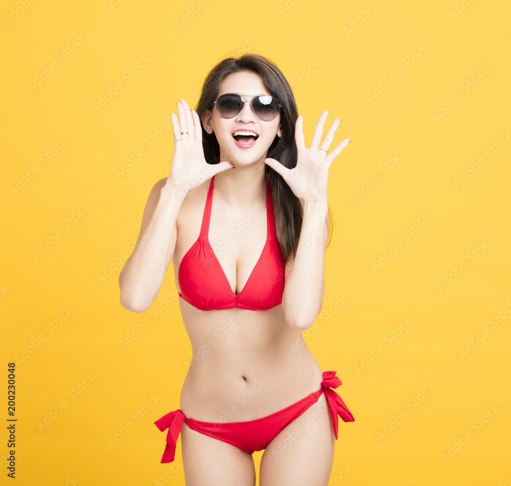happy young woman in swimsuit and shouting. happy young woman in swimsuit and shouting.