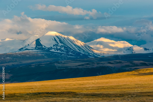 Mountain landscape with clouds. Mountain valley. The Altai mountains. Travel adventure vacation background © antonbelo