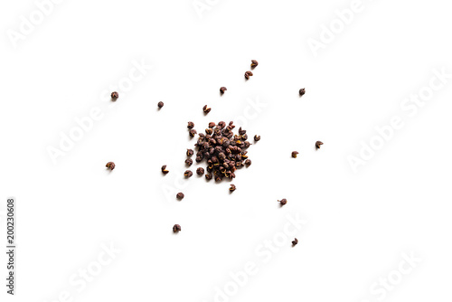Dried whole seed of Neapli Timut pepper isolated on a white background.  Horizontal composition. Top view photo