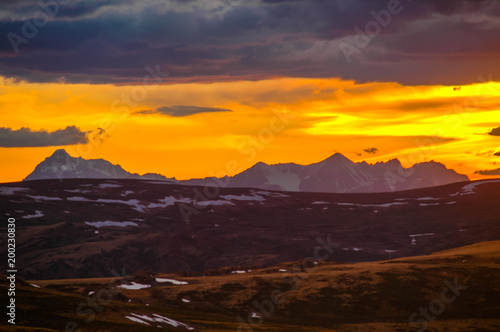 Mountain landscape with clouds. Mountain valley. The Altai mountains. Dramatic sunset in the mountains. Travel adventure vacation background © antonbelo