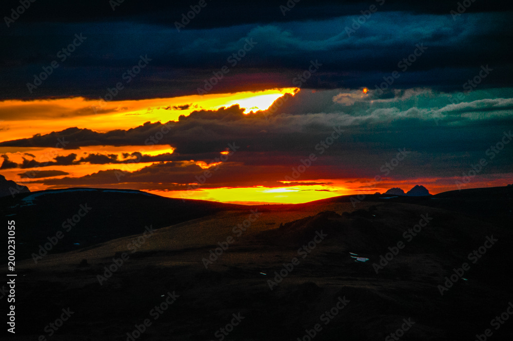 Mountain landscape with clouds. Mountain valley. The Altai mountains. Dramatic sunset in the mountains. Travel adventure vacation background