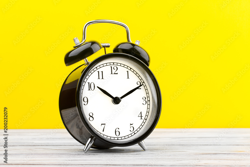 alarm clock wooden plank colored background alarm clock wooden plank colored background