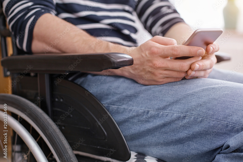 Online communication. Differently abled person being at home, typing message Online communication. Differently abled person being at home, typing message