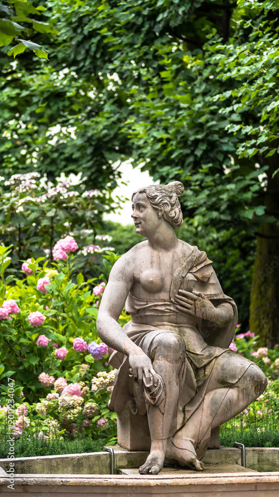 Susannabrunnen (Susanna fountain) - statue of young half naked woman startled by someones presence while bathing. Created by Hans Waldburger, 1700. Mirabellgarten (Mirabell garden), Salzburg, Austria