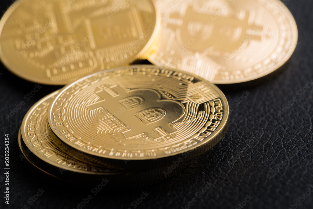Bitcoins on leather background Bitcoins on leather background