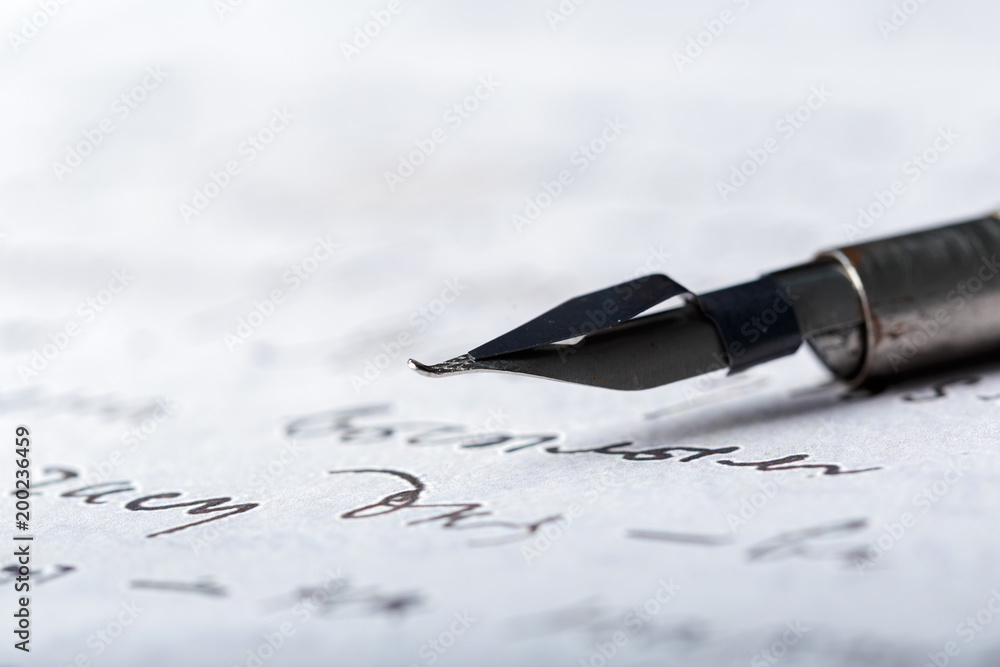 Fototapeta premium Fountain pen on an antique handwritten letter