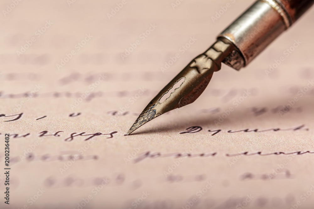 Fototapeta premium Fountain pen on an antique handwritten letter
