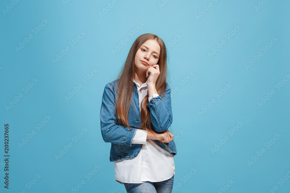 Young serious thoughtful teen girl. Doubt concept.